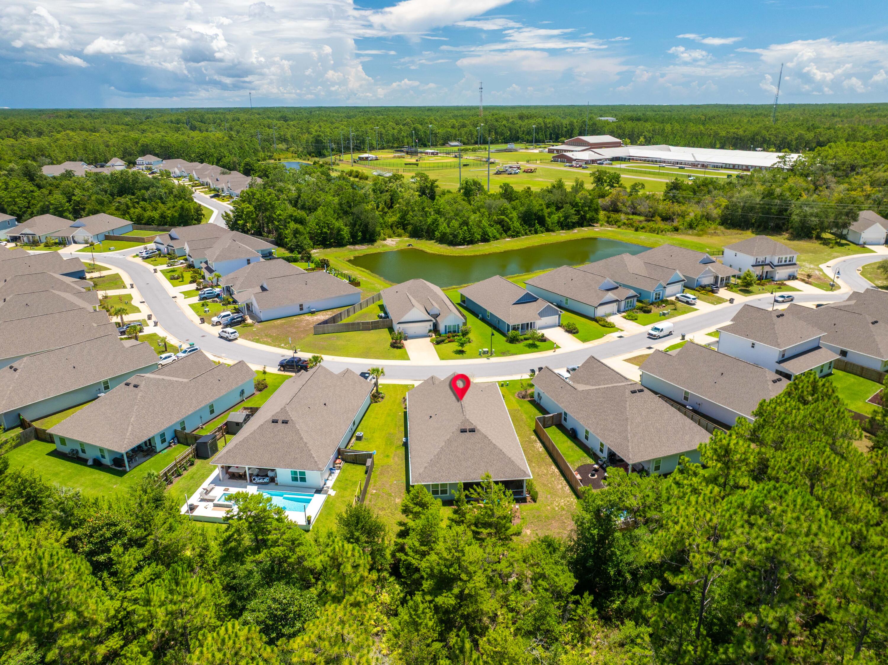 157 Jr's Way Santa Rosa Beach, FL 32459 - Photo 2 of 45 an aerial view of a house with a garden