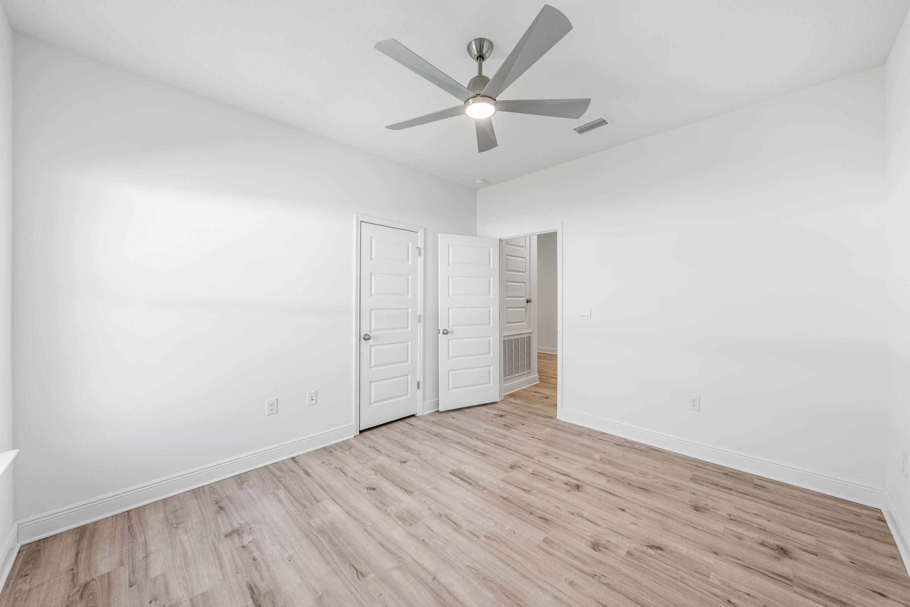 157 Jr's Way Santa Rosa Beach, FL 32459 - Photo 25 of 45 an empty room with wooden floor and ceiling fan
