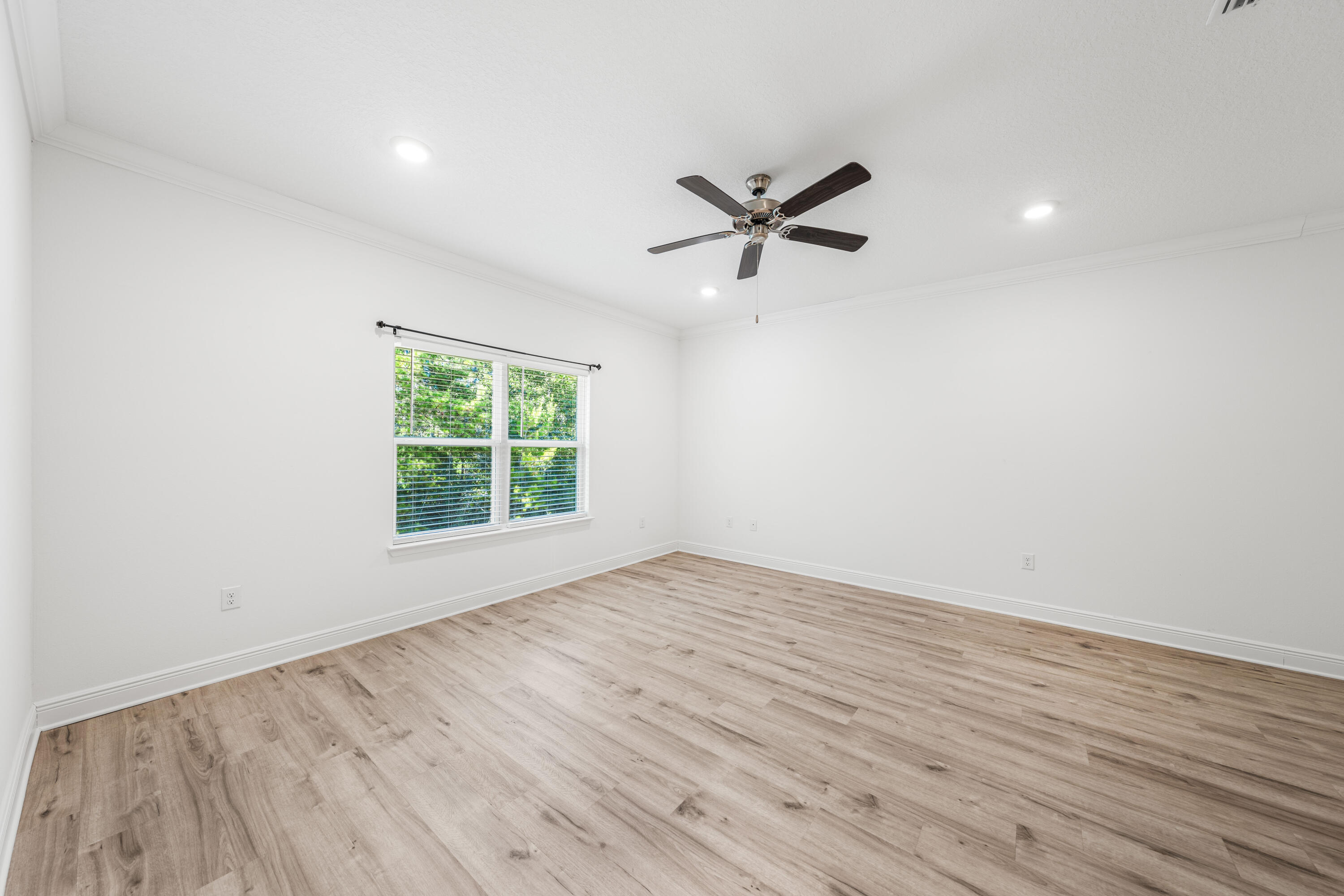 157 Jr's Way Santa Rosa Beach, FL 32459 - Photo 27 of 45 a view of empty room with wooden floor and fan