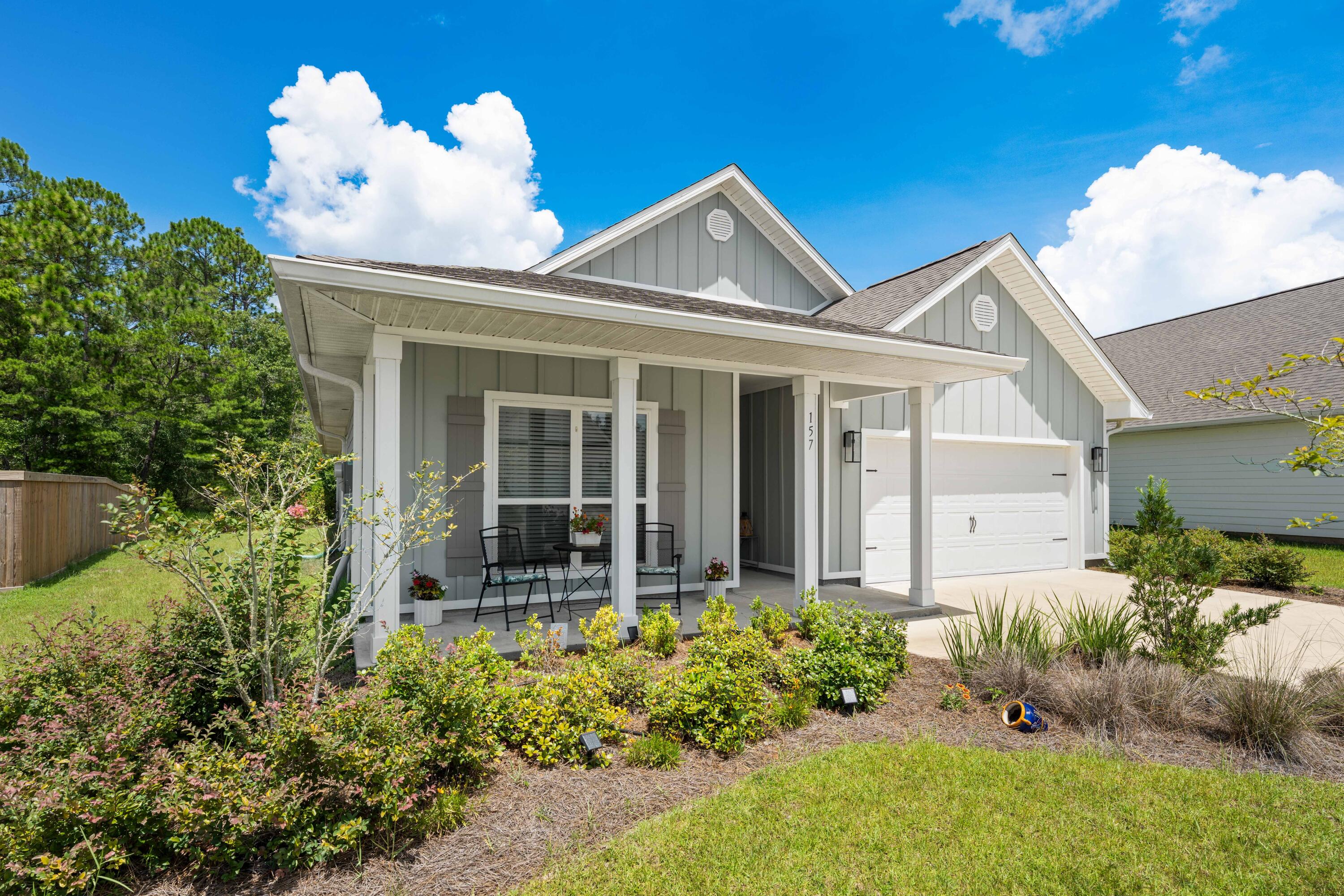 157 Jr's Way Santa Rosa Beach, FL 32459 - Photo 3 of 45 a front view of a house with a yard