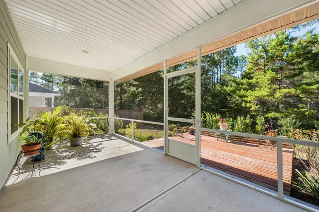 a lobby with furniture and garden view