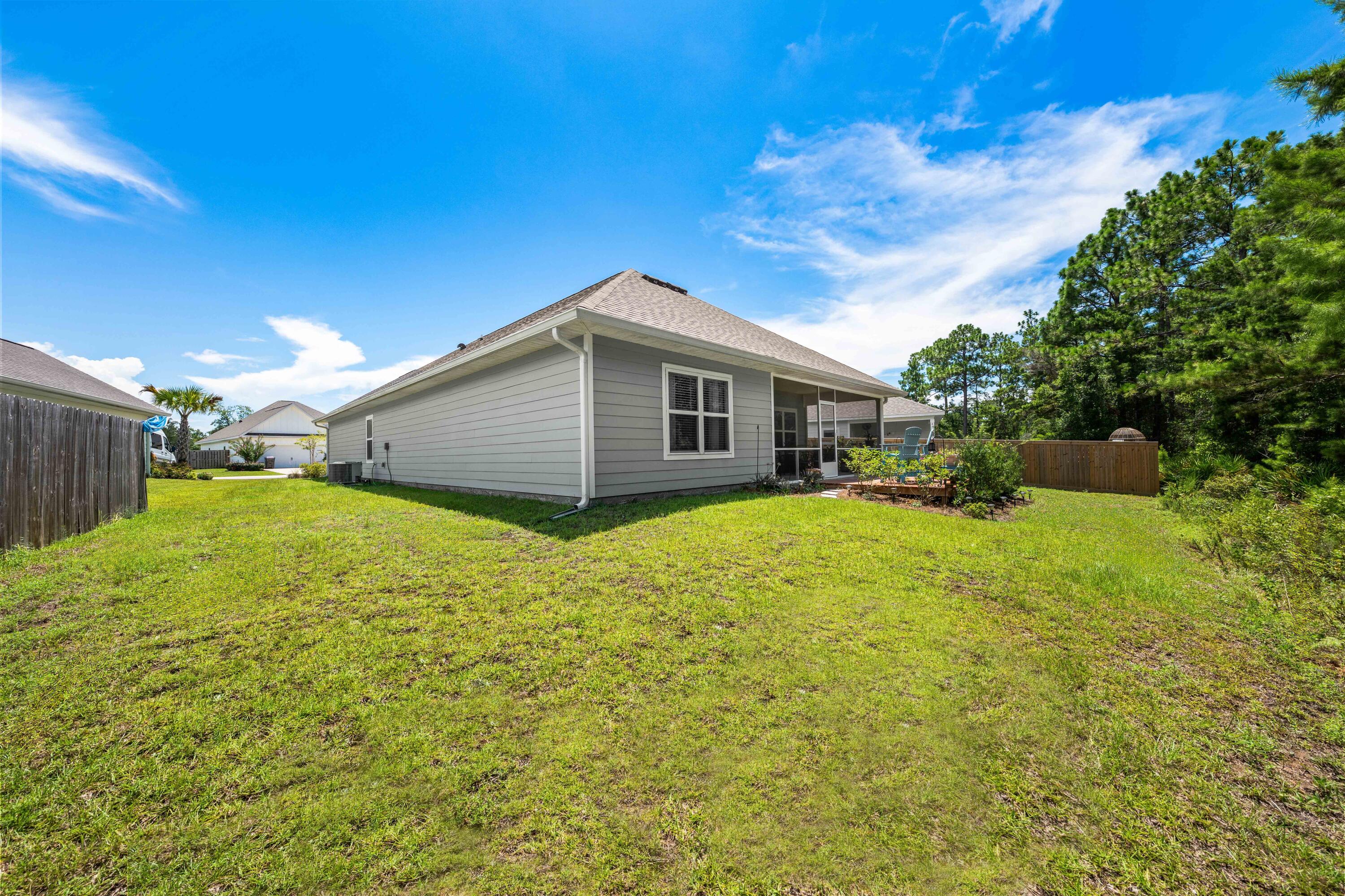 157 Jr's Way Santa Rosa Beach, FL 32459 - Photo 38 of 45 a front view of house with yard and trees