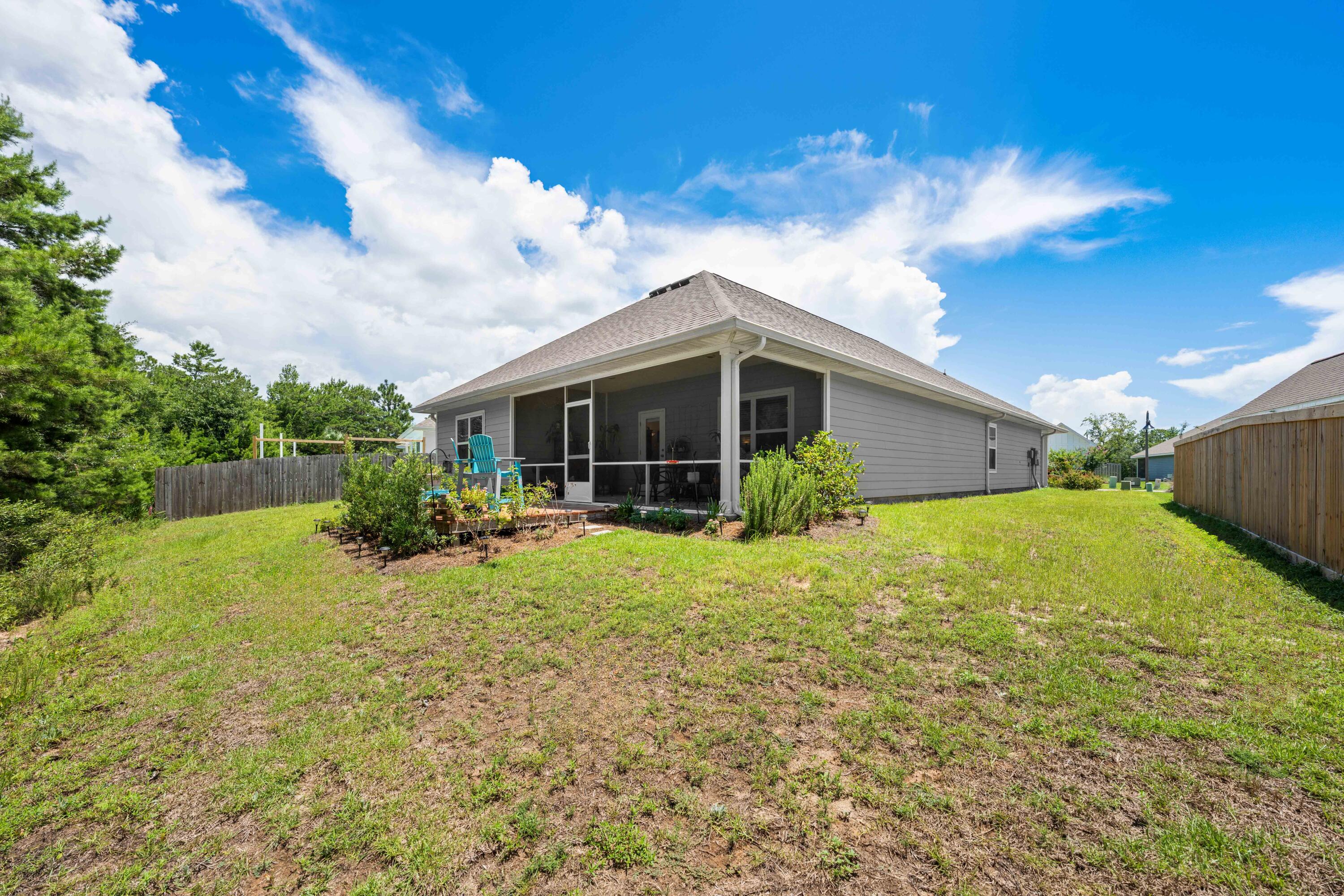 157 Jr's Way Santa Rosa Beach, FL 32459 - Photo 39 of 45 a view of a house with backyard and garden