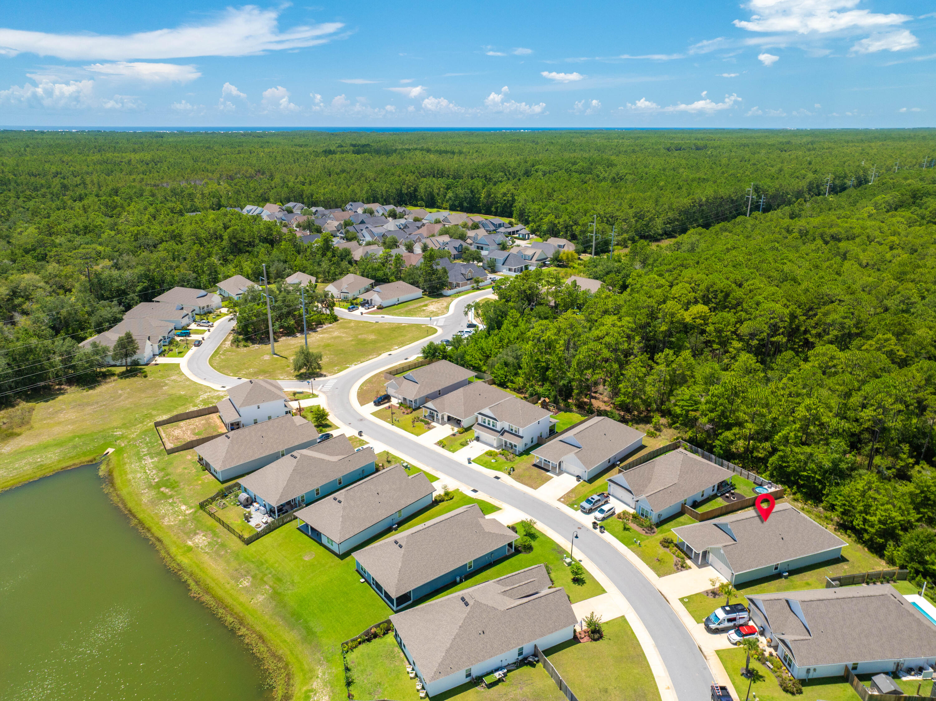 157 Jr's Way Santa Rosa Beach, FL 32459 - Photo 41 of 45 an aerial view of a house with a garden and lake view