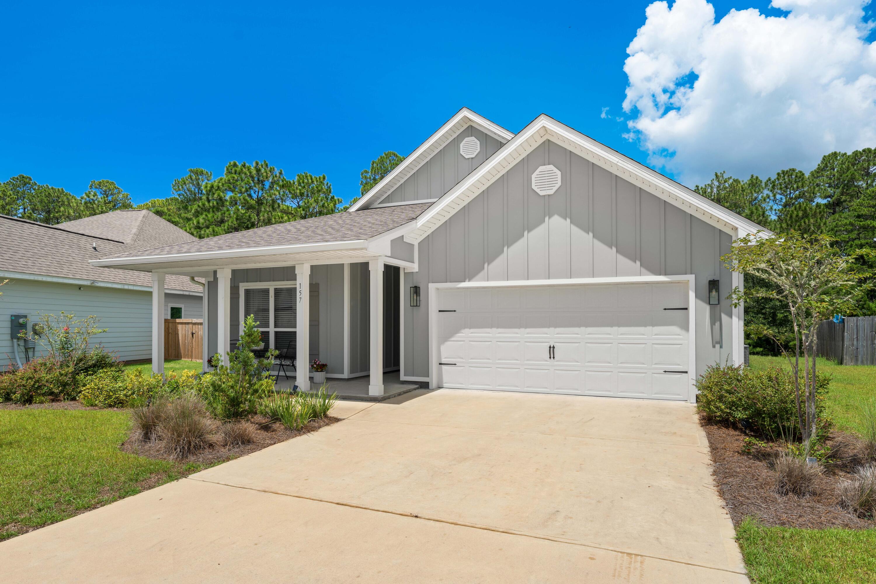 157 Jr's Way Santa Rosa Beach, FL 32459 - Photo 5 of 45 a front view of a house with a yard