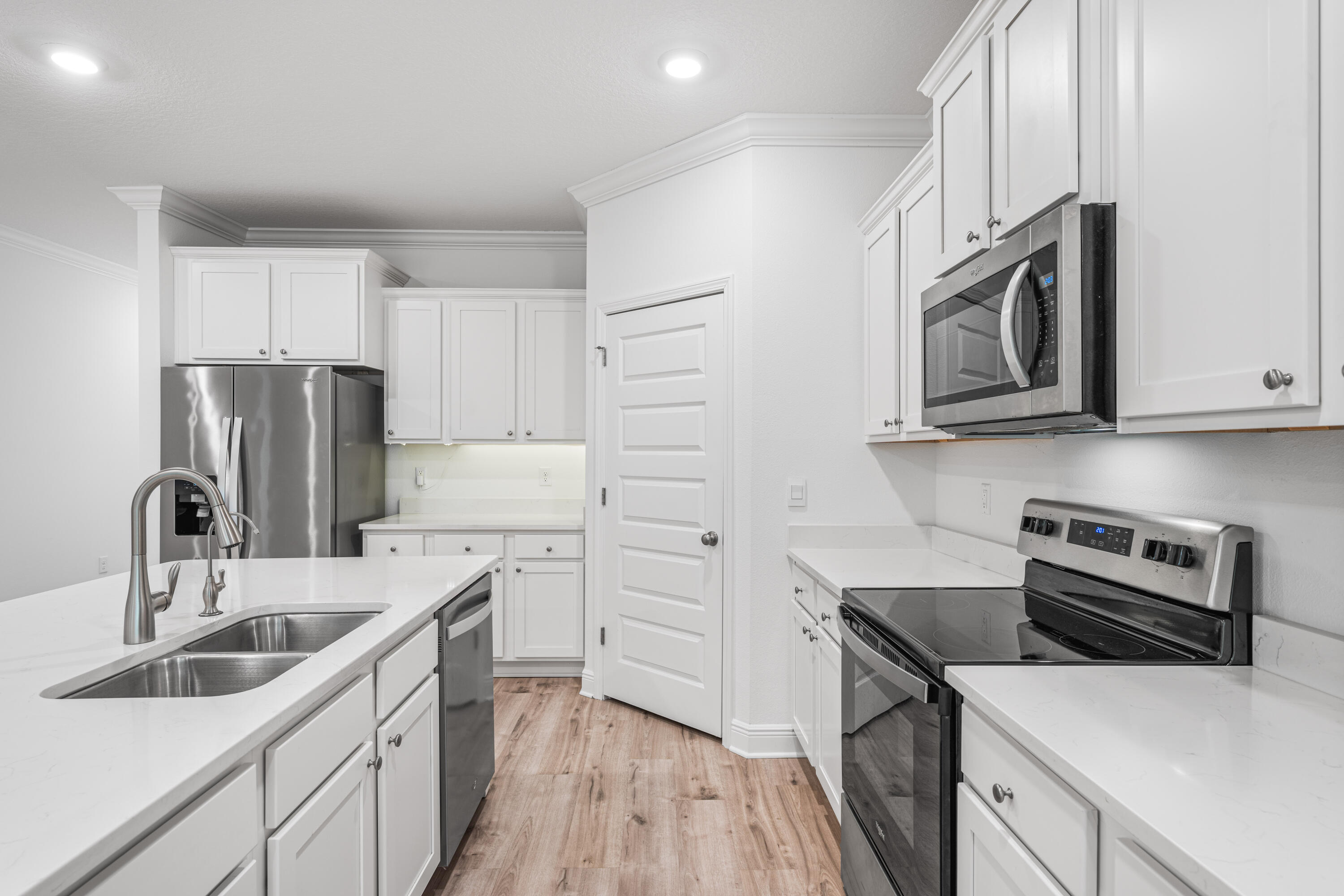 157 Jr's Way Santa Rosa Beach, FL 32459 - Photo 7 of 45 a kitchen with stainless steel appliances granite countertop a sink stove and refrigerator