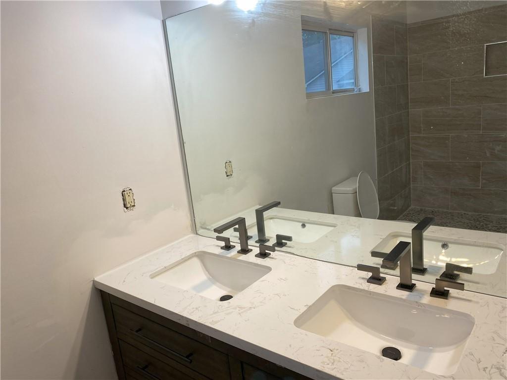 Undisclosed Address Decatur, GA 30034 - Photo 12 of 19 a bathroom with a sink and a mirror