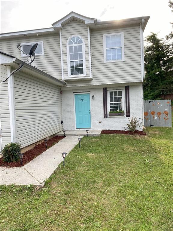 Undisclosed Address Decatur, GA 30034 - Photo 2 of 19 a front view of a house with a yard