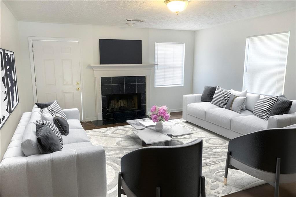 Undisclosed Address Decatur, GA 30034 - Photo 4 of 19 a living room with furniture and a fireplace