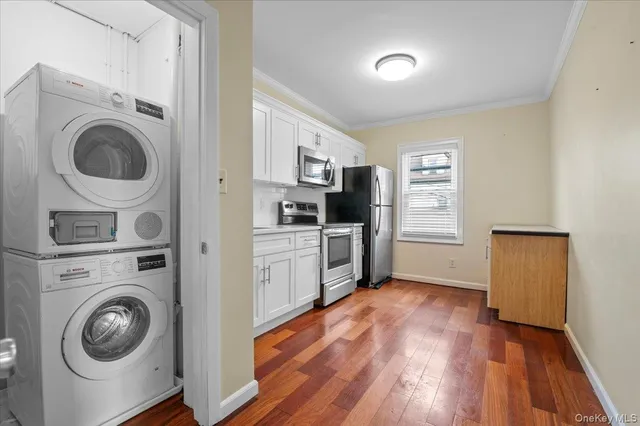 a view of a kitchen with washer and dryer