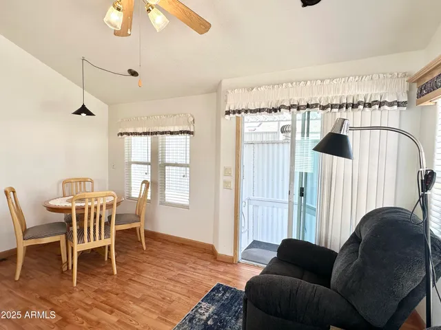 a view of a dining room with furniture and wooden floor