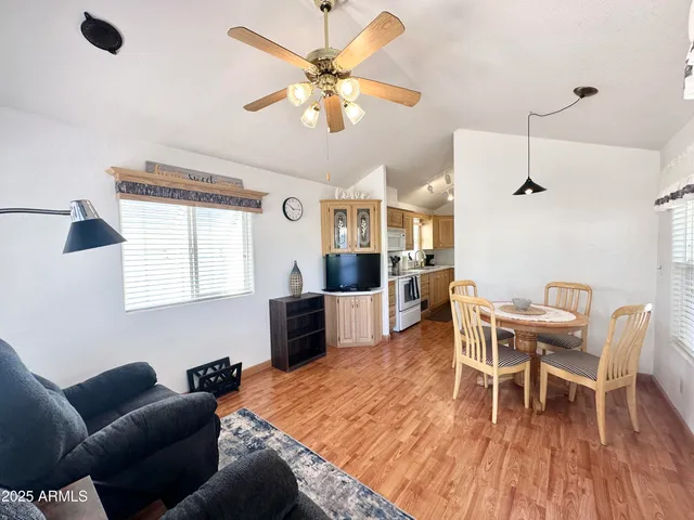 a view of a dining room with furniture window and wooden floor
