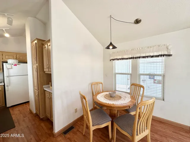 a kitchen with a sink a stove and cabinets