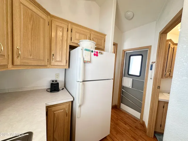 a kitchen with a sink and a refrigerator