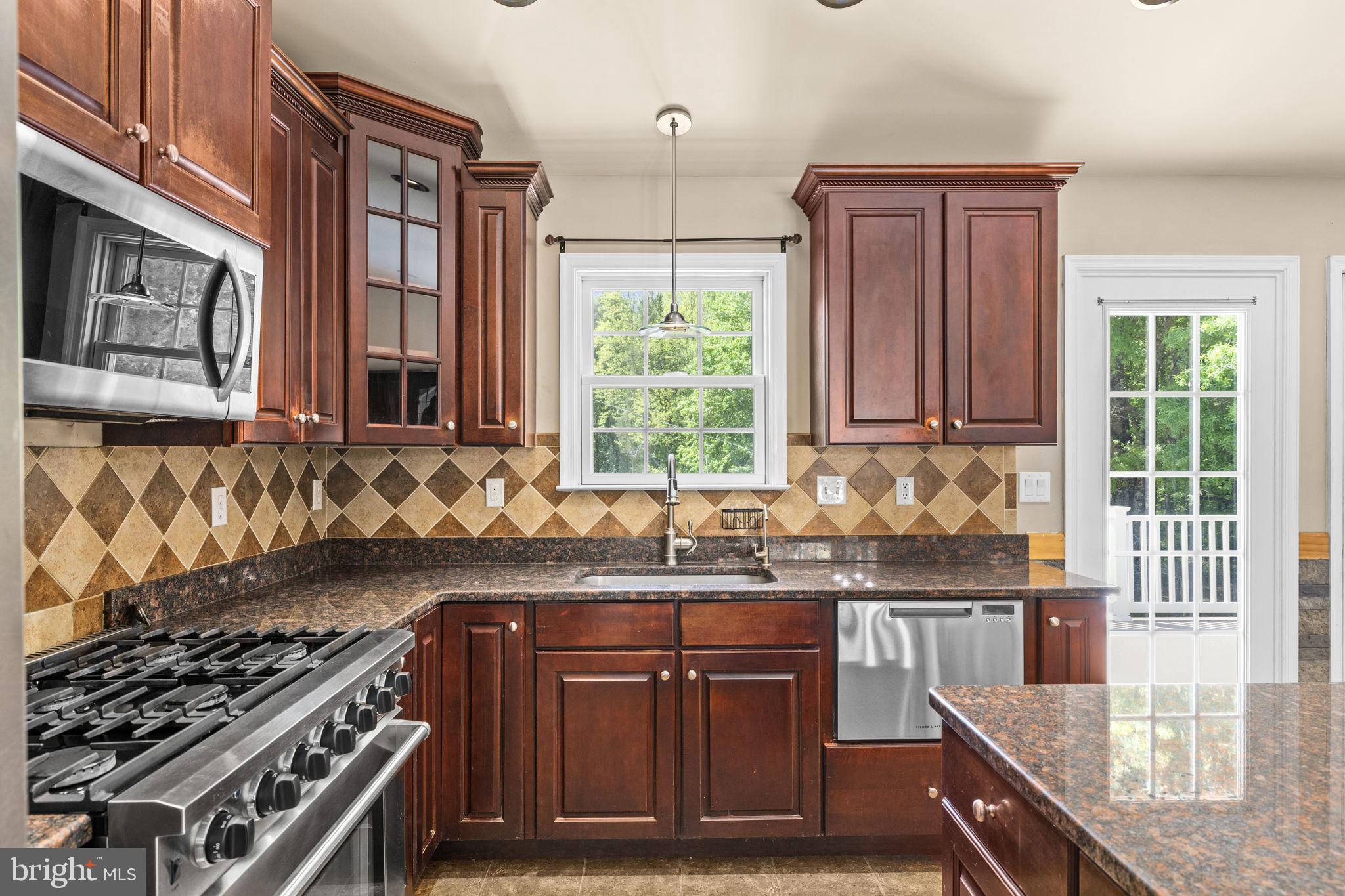 12615 Post Oak Road Spotsylvania, VA 22551 - Photo 15 of 67 Elegant kitchen with rich cabinetry.