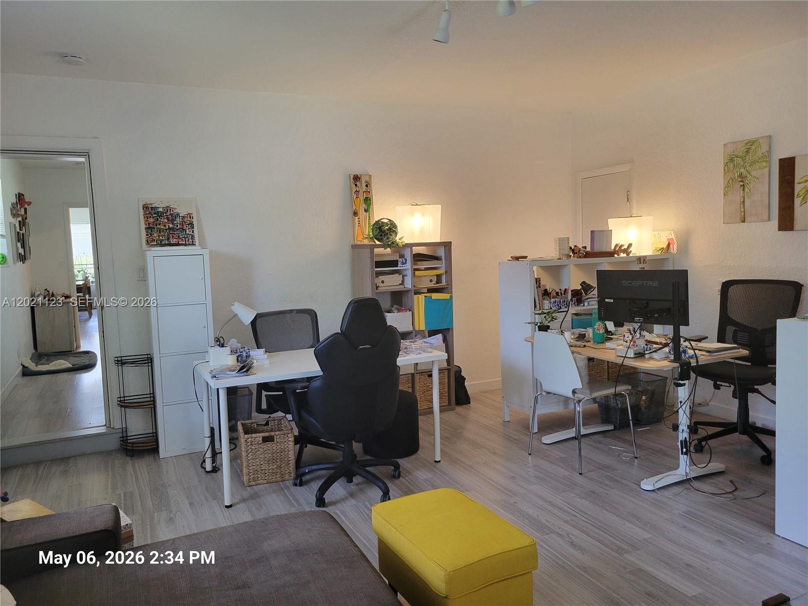 13220 Southwest 99th Place Miami, FL 33176 - Photo 6 of 16 a view of a workspace with furniture and a window