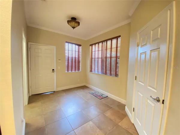 a view of an empty room with a window