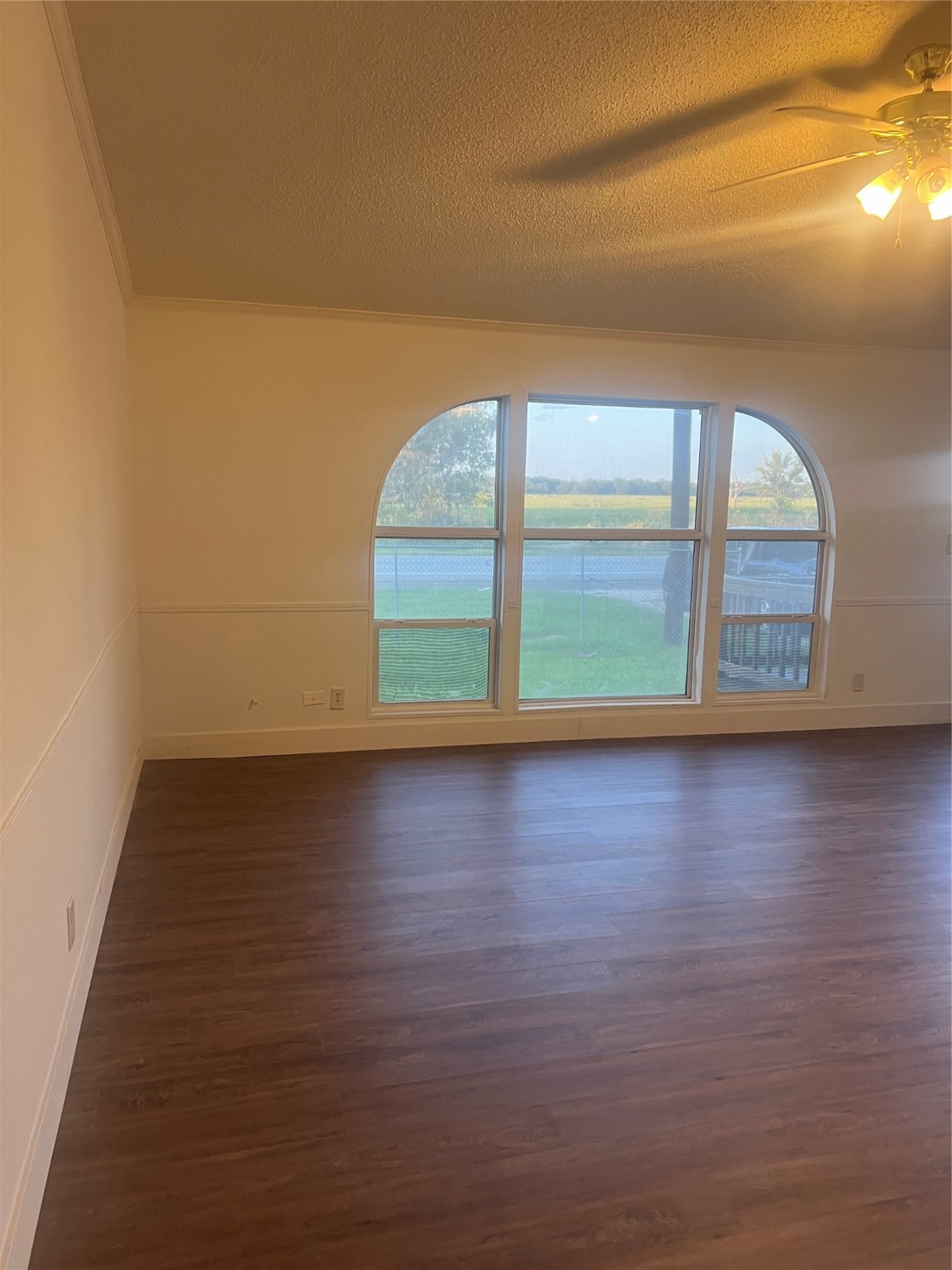 10312 Farm To Market Road 457 Bay City, TX 77414 - Photo 11 of 16 a view of a room with wooden floor and window