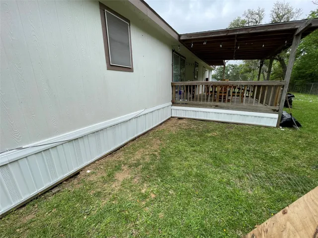 a view of a roof deck with wooden fence