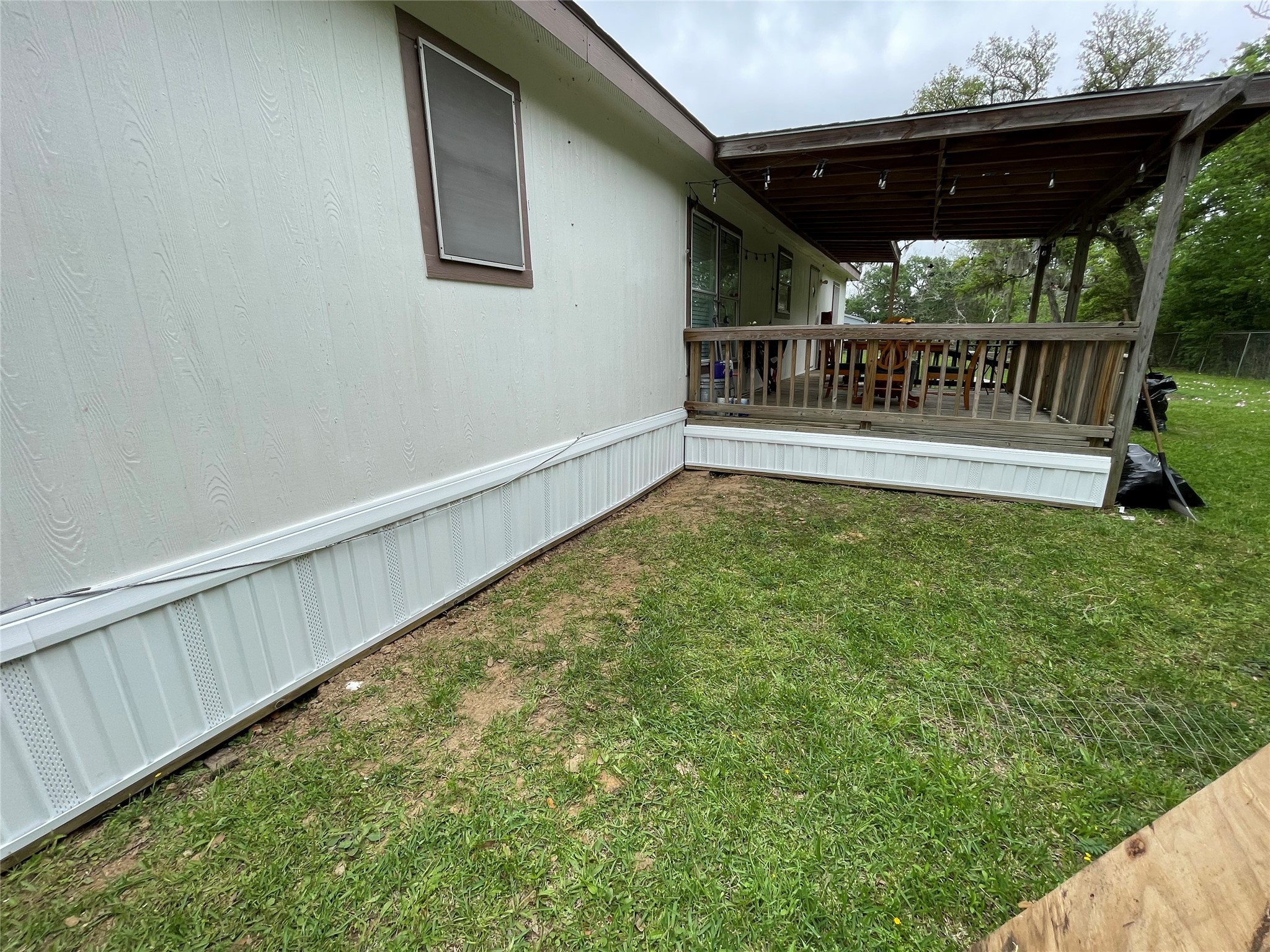 10312 Farm To Market Road 457 Bay City, TX 77414 - Photo 15 of 16 a view of a roof deck with wooden fence