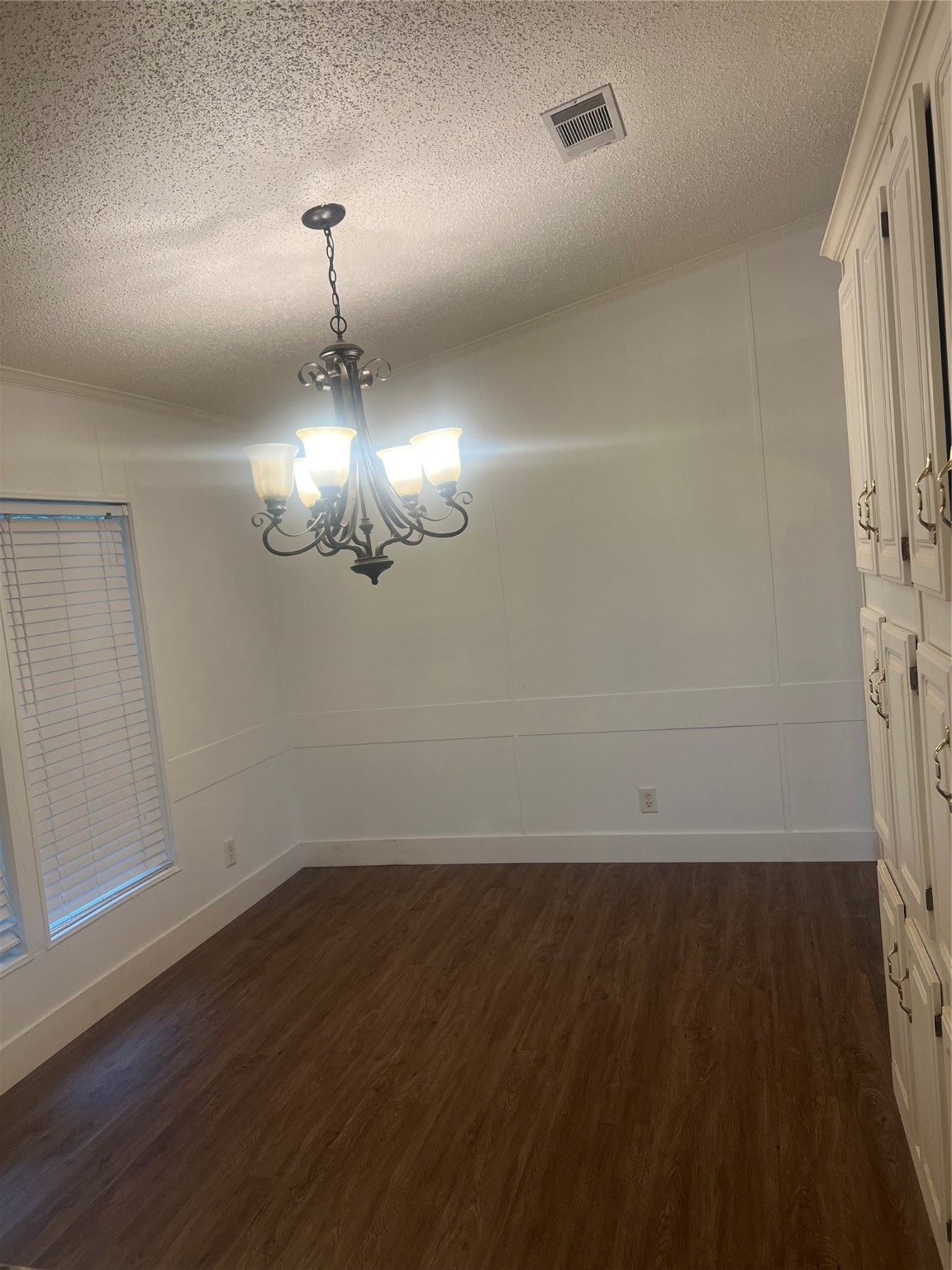 10312 Farm To Market Road 457 Bay City, TX 77414 - Photo 8 of 16 wooden floor in an empty room with a mirror