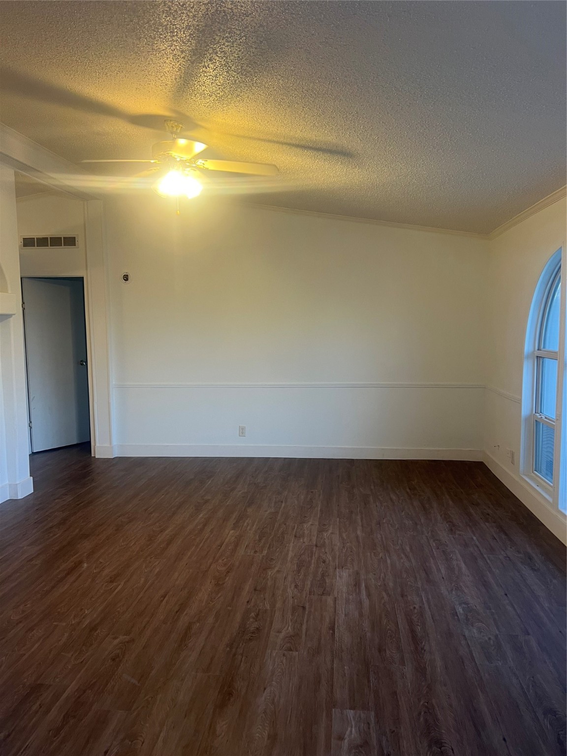 10312 Farm To Market Road 457 Bay City, TX 77414 - Photo 10 of 16 a view of an empty room with wooden floor and a window