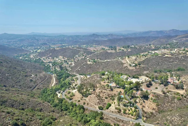 a view of a city with green space