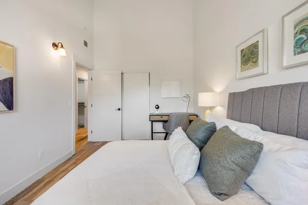 a bedroom with a bed and a cabinets