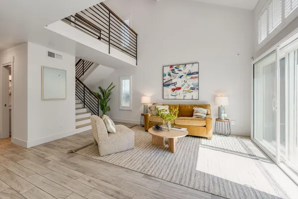a living room with furniture and a table