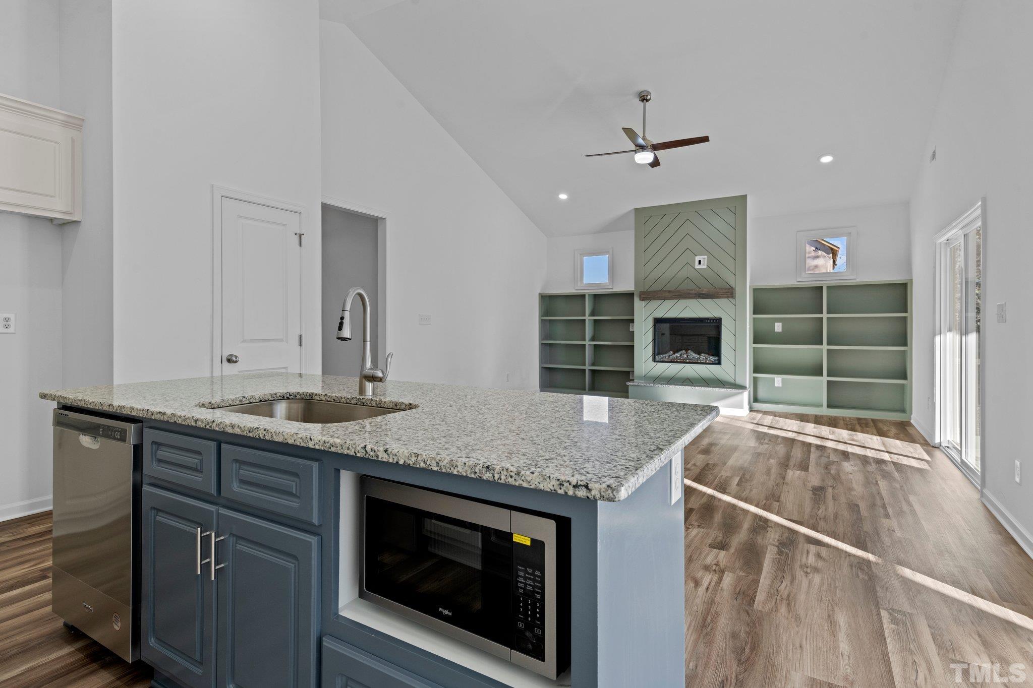 9771 Chapman Road Bailey, NC 27807 - Photo 11 of 35 a kitchen with stainless steel appliances granite countertop a stove and a sink