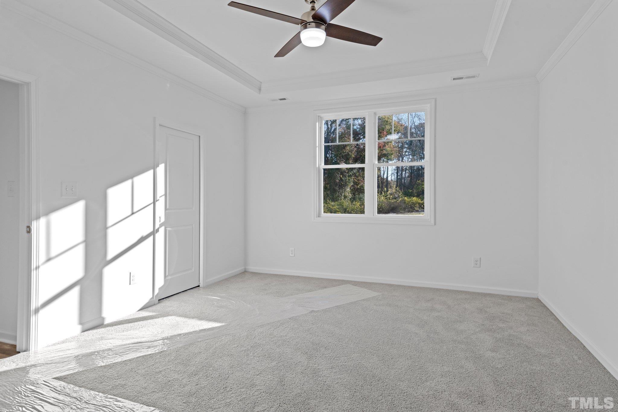 9771 Chapman Road Bailey, NC 27807 - Photo 13 of 35 an empty room with windows and fan