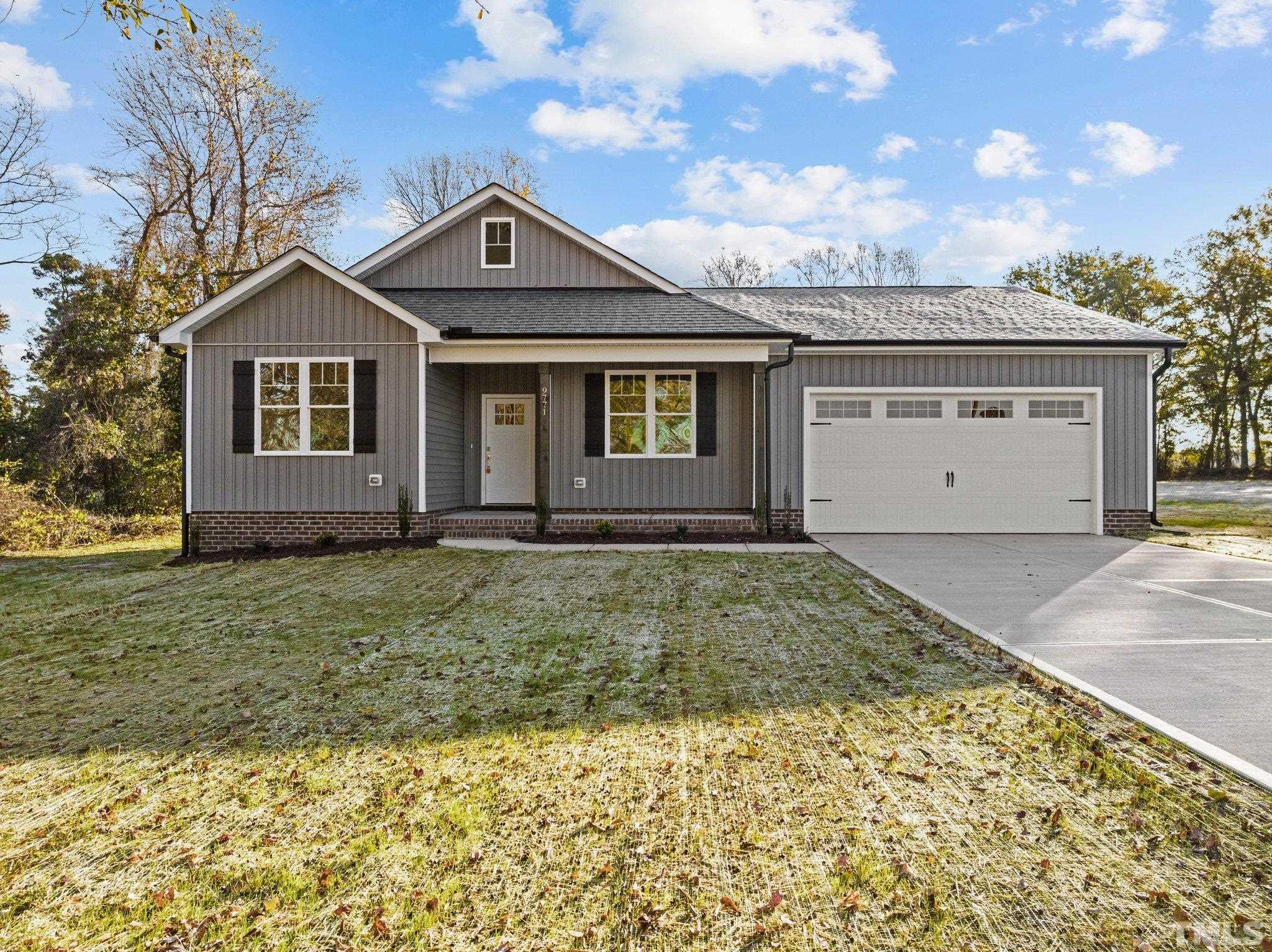 9771 Chapman Road Bailey, NC 27807 - Photo 2 of 35 a front view of a house with a yard