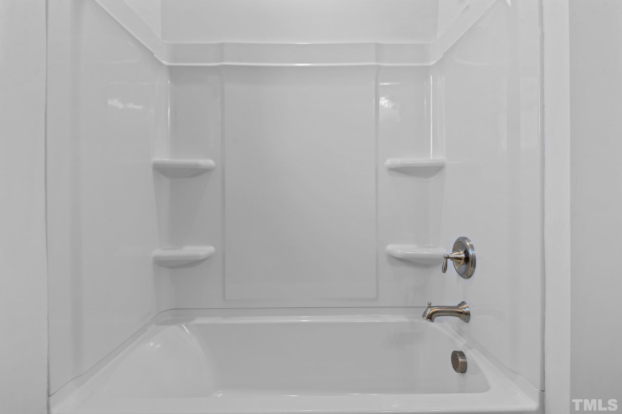9771 Chapman Road Bailey, NC 27807 - Photo 23 of 35 a close view of a bathtub in a bathroom