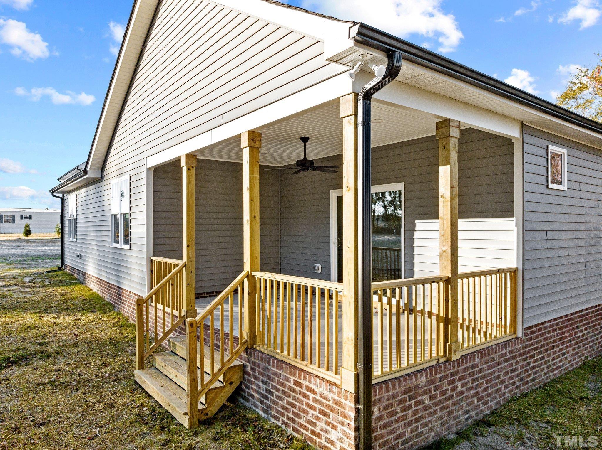 9771 Chapman Road Bailey, NC 27807 - Photo 29 of 35 a view of a house with a wooden fence