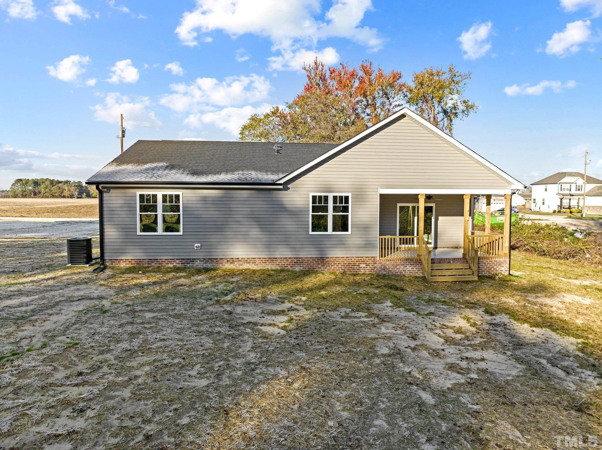 9771 Chapman Road Bailey, NC 27807 - Photo 34 of 35 a view of a house with a backyard