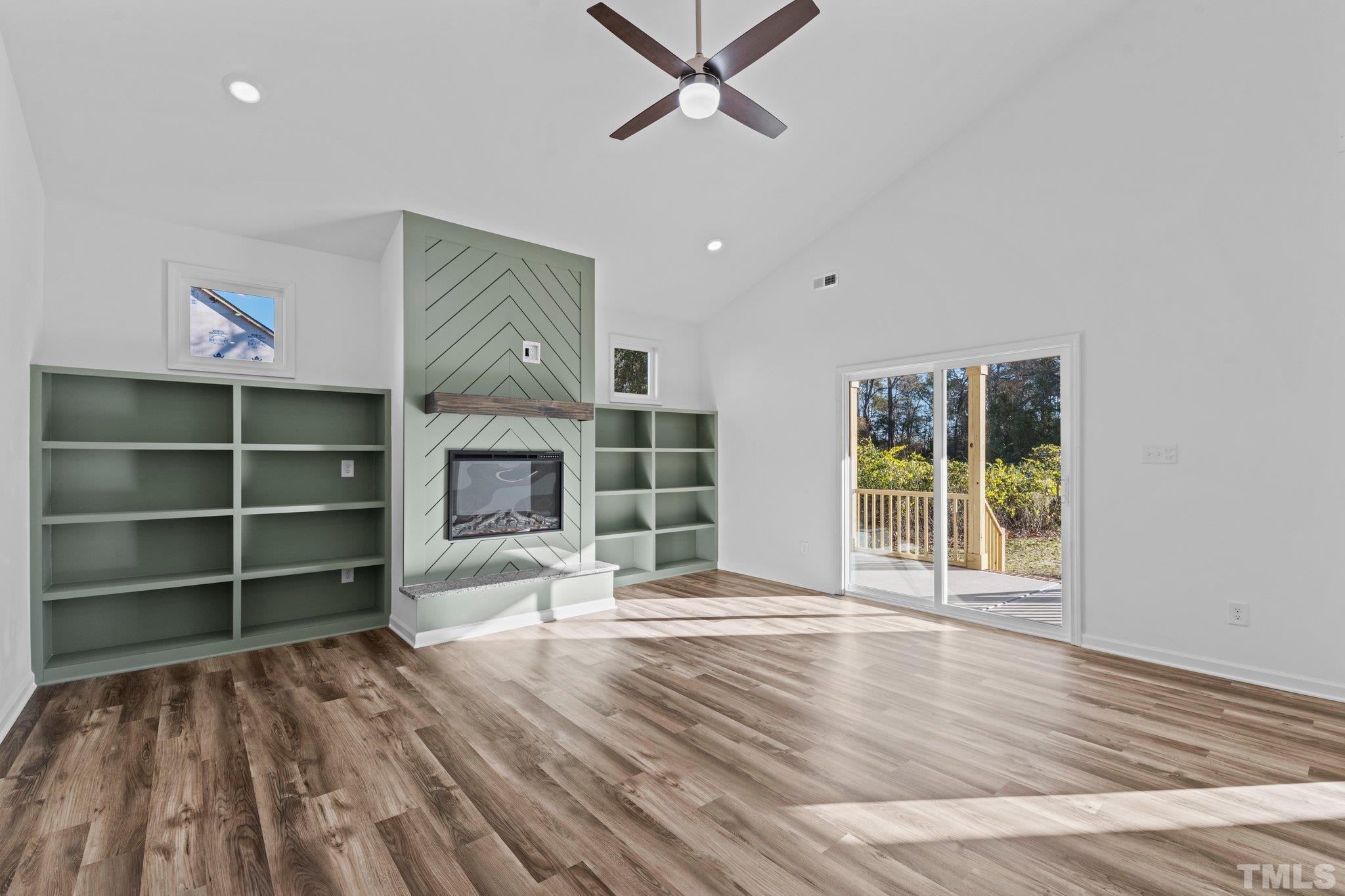 9771 Chapman Road Bailey, NC 27807 - Photo 7 of 35 a view of a livingroom with a hardwood floor and a ceiling fan