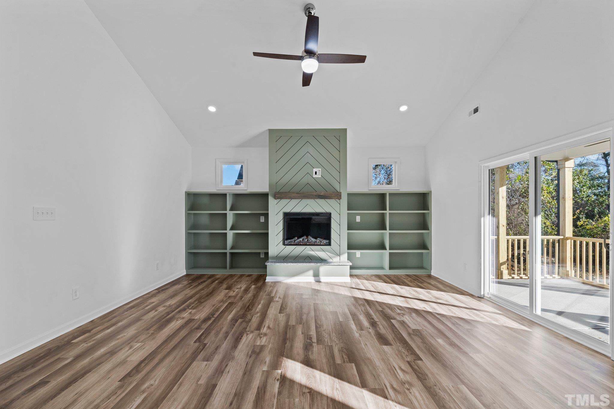 9771 Chapman Road Bailey, NC 27807 - Photo 8 of 35 a view of a room with a fireplace and wooden floor