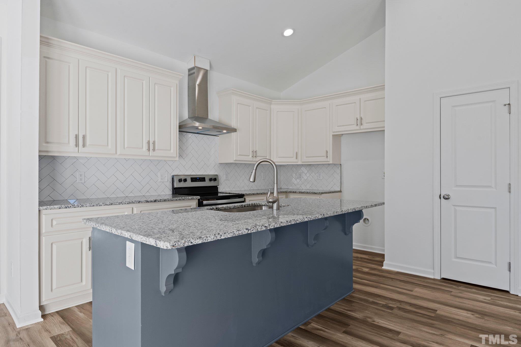 9771 Chapman Road Bailey, NC 27807 - Photo 10 of 35 a kitchen with stainless steel appliances a sink stove and cabinets