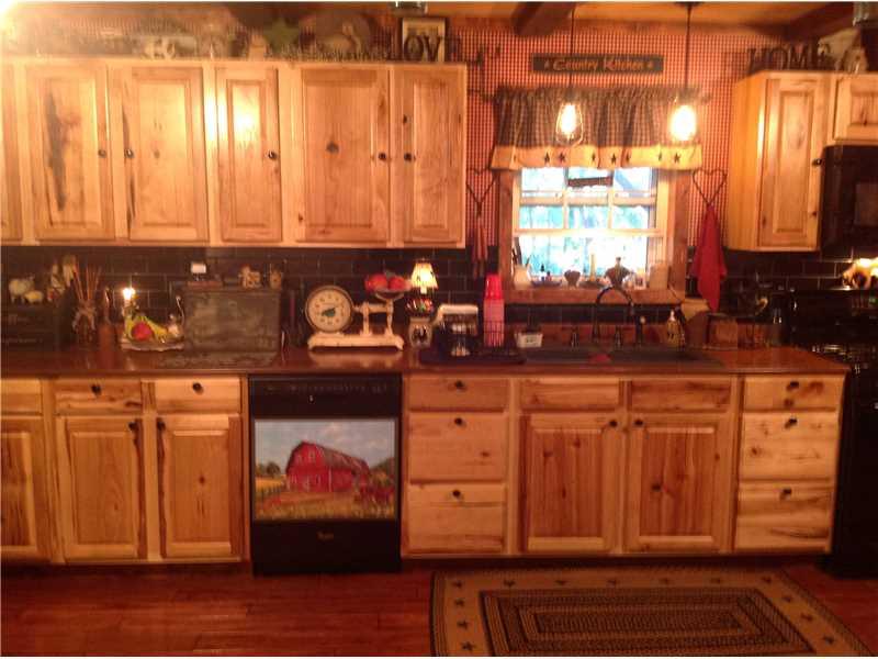 352 Wise Road Jamestown, PA 16134 - Photo 8 of 25 Kitchen. Kitchen totally gutted. New Hickory cabinets and hardware added. New wainscot. Built in microwave, dishwasher and stove included. Removeable Barn magnetic picture on stove.