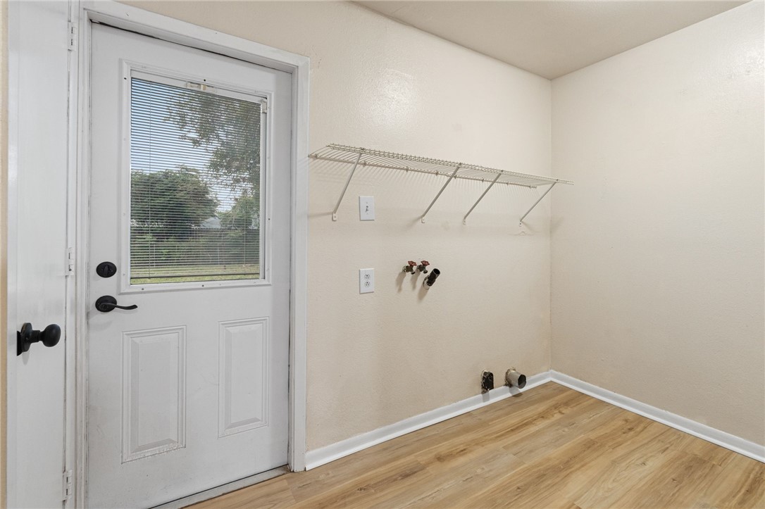 5921 Riley Drive Corpus Christi, TX 78412 - Photo 9 of 20 a view of a small space with wooden floor and a window