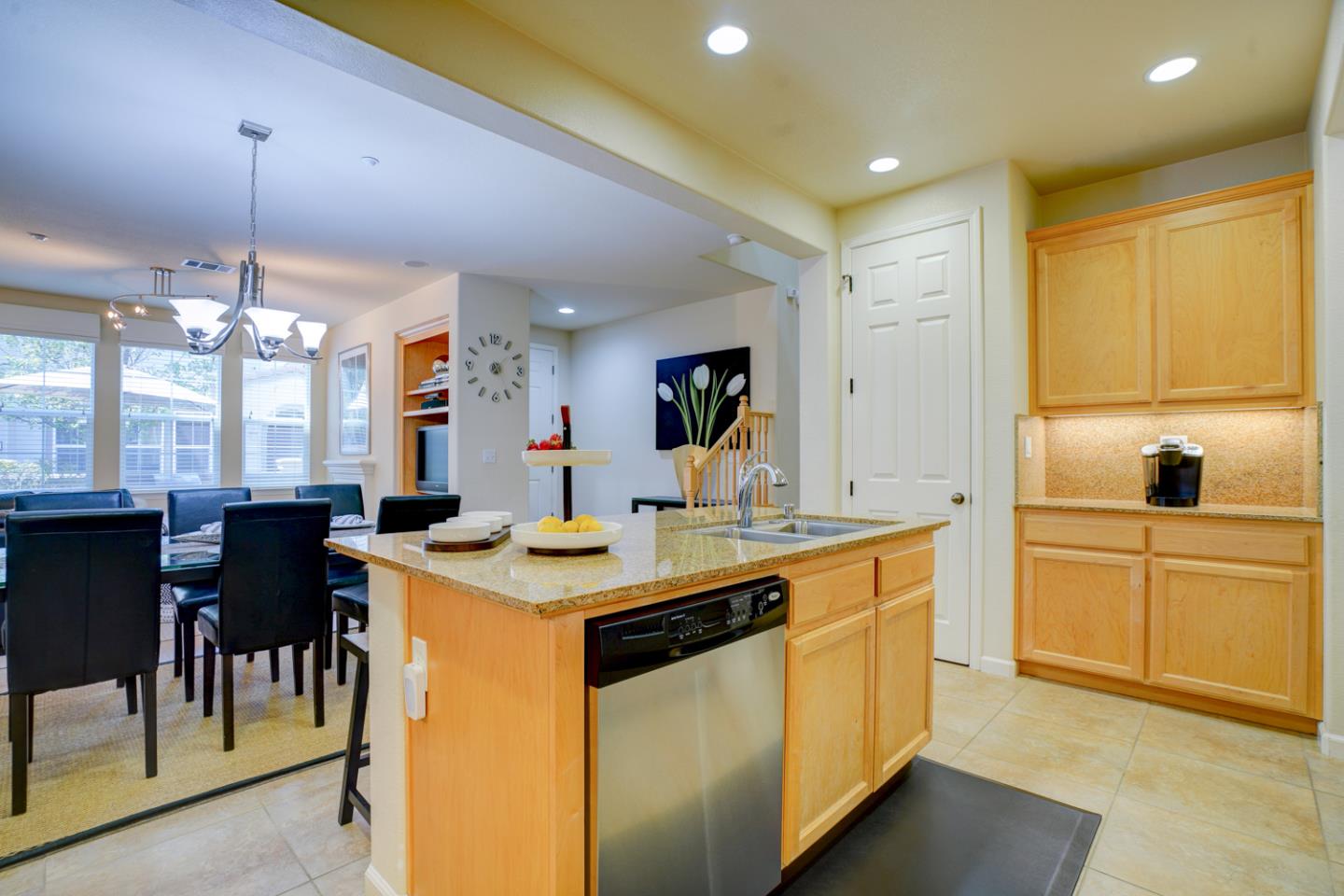 5236 Fioli Loop San Ramon, CA 94582 - Photo 12 of 40 a kitchen with kitchen island granite countertop a sink a center island and appliances