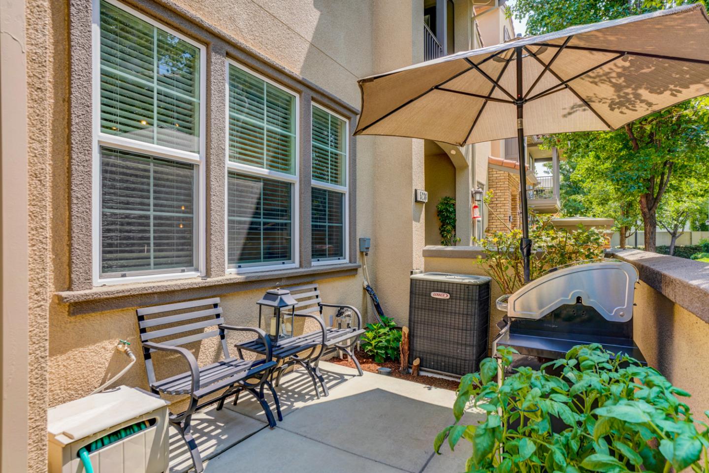 5236 Fioli Loop San Ramon, CA 94582 - Photo 3 of 40 a view of a chair and table under an umbrella in the patio