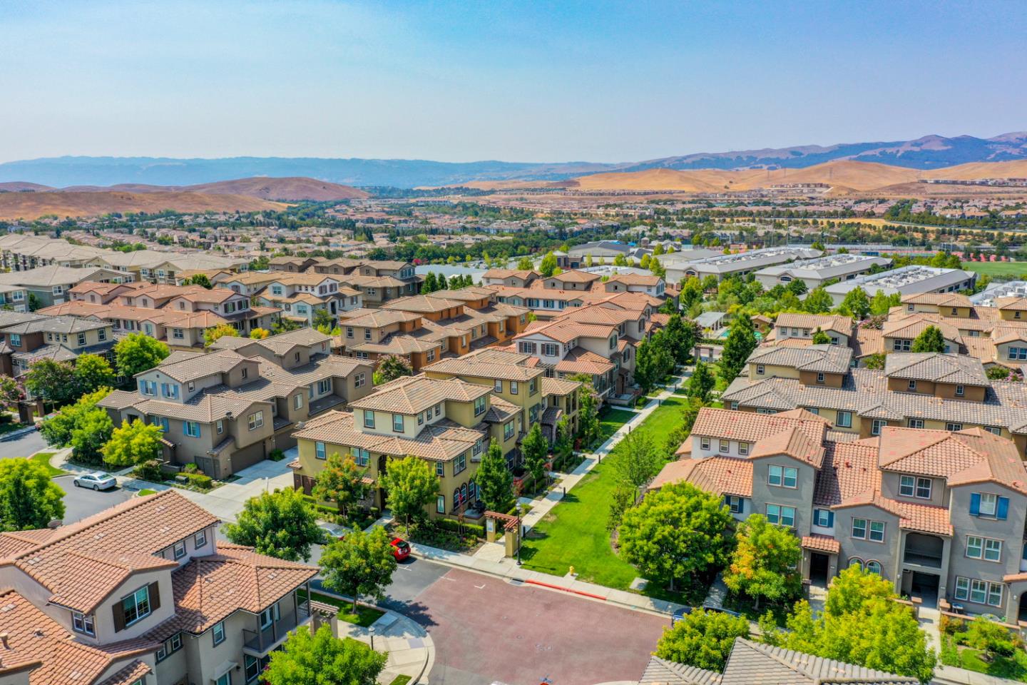 5236 Fioli Loop San Ramon, CA 94582 - Photo 34 of 40 an aerial view of a city with lots of residential buildings and mountain view in back