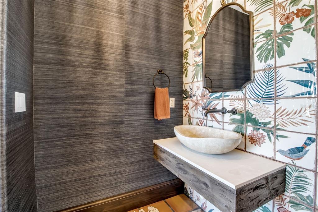 121 North Casey Key Road Osprey, FL 34229 - Photo 29 of 63 a bathroom with a sink and a mirror