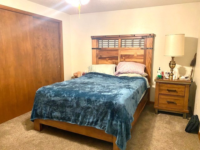 1817 6th Avenue Sterling, IL 61081 - Photo 12 of 16 a bedroom with a bed and two windows