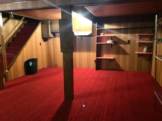 a view of a living room with a wooden floor