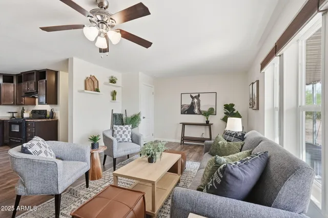 a living room with furniture and a large window