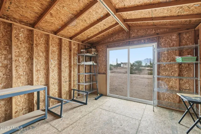 a view of entryway with wooden floor and door