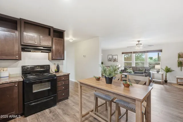 a kitchen with a table and chairs in it