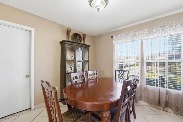a view of a dining room with furniture window and outside view